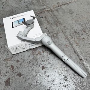 DJI Osmo Mobile SE, 3-Axis Gimbal Stabili for iPhone Viral Vlog TikTok Tripod.